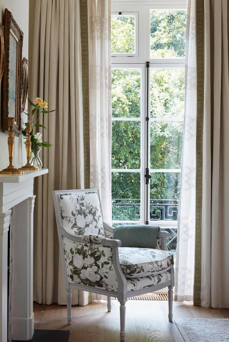 Traditional arm chair overlooking a Kensington garden square and Juliette balcony