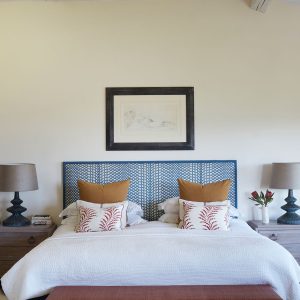 A beautiful bedroom of a renovated South of France villa with interiors by Studio Indigo