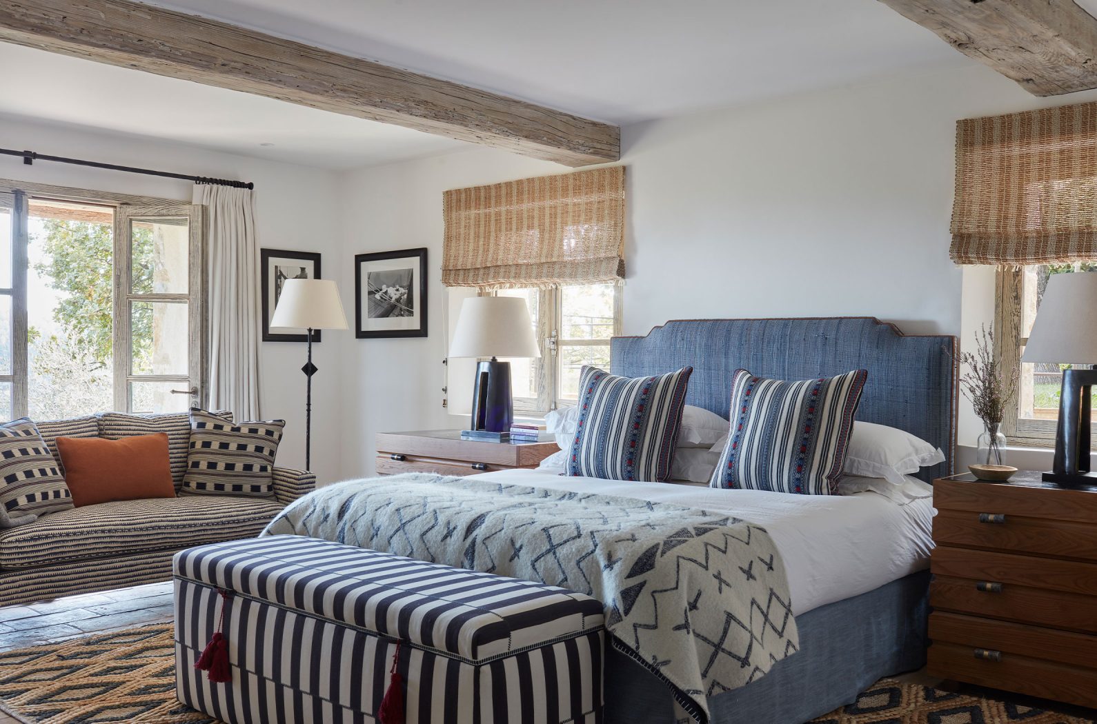 A beautiful bedroom of a renovated South of France villa with interiors by Studio Indigo