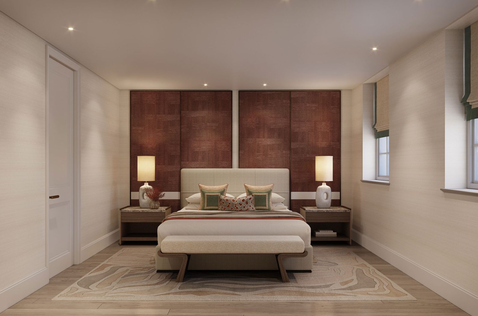 A primary bedroom with pops of burgundy and green designed by Studio Indigo