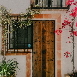 decorative wood door with tile trim and flowers in Marbella