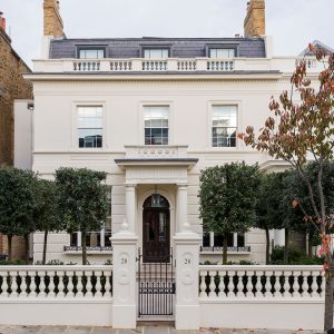 A white stucco front facade residential building in London